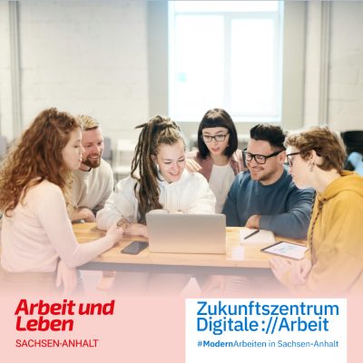 Sechs jüngere Erwachsene sitzen um einen Laptop herum.